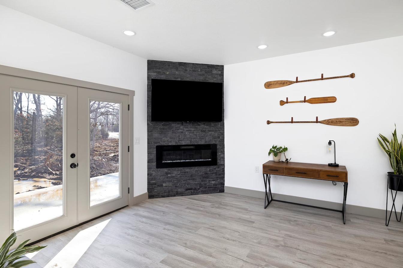 Living room — paddles & fireplace
