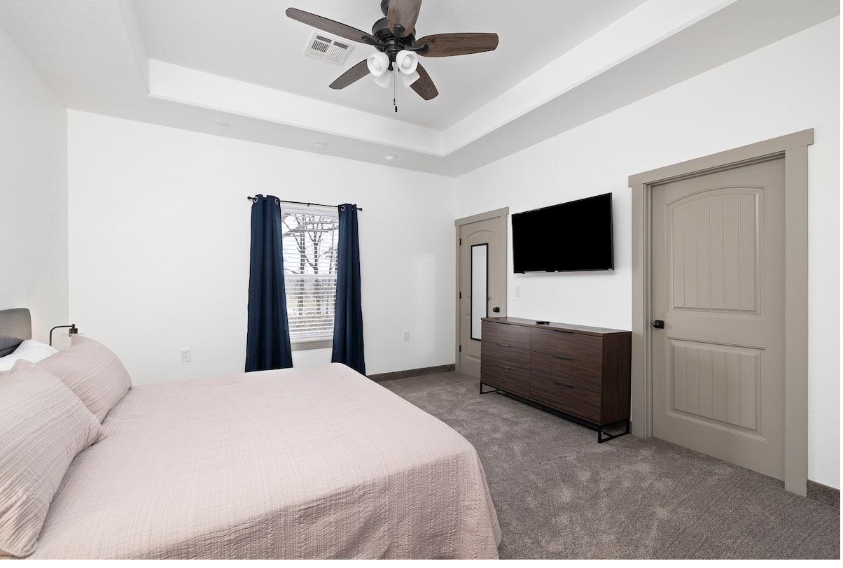 Master bedroom — dresser, TV & closet
