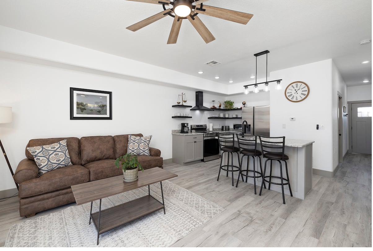 Living room & open kitchen — wide view