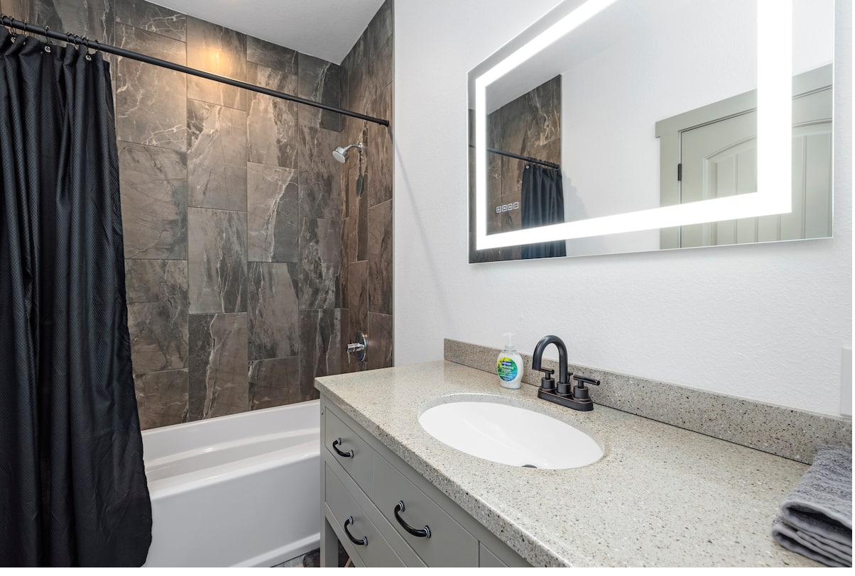 Tub & shower with black curtain
