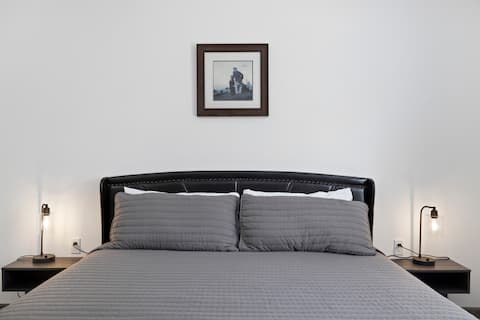 Queen bed with headboard & bedside lamps