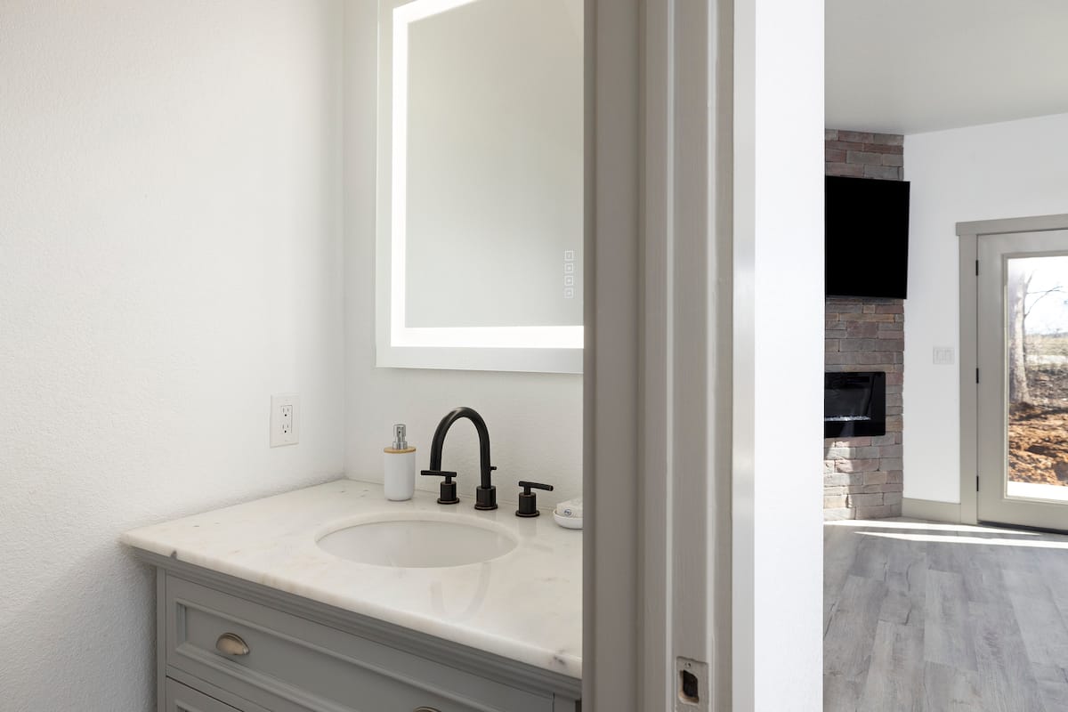 Half bath — marble vanity & LED mirror