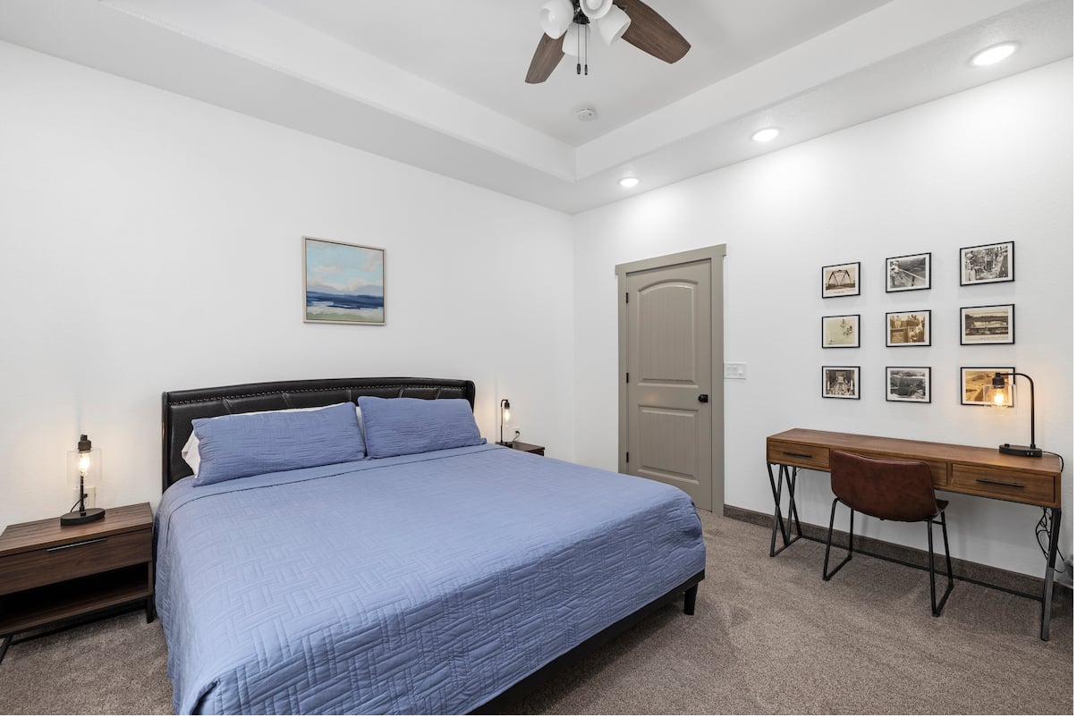 Master bedroom — bed, desk & gallery wall